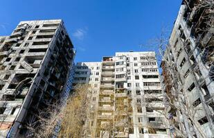 destroyed and burned houses in the city Russia Ukraine war photo