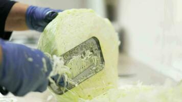 woman chopping cabbage on table with special knife video