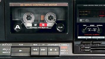 vintage audio cassette plays in tape deck video