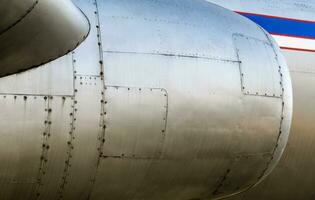 airplane body with turbine close up photo