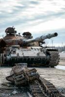 damaged military tank on a city street in Ukraine photo