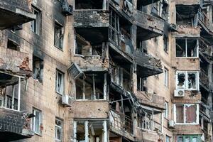 destroyed and burned houses in the city Russia Ukraine war photo