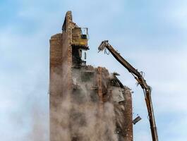construction equipment destroys affected houses war in Ukraine photo