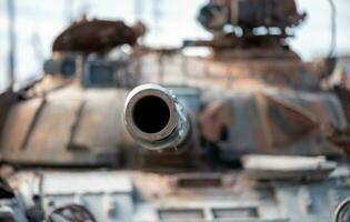 damaged military tank on a city street in Ukraine photo