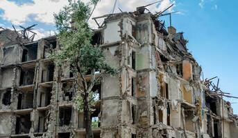 destroyed and burned houses in the city in Ukraine war photo