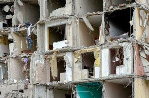 destroyed and burned houses in the city during the war in Ukraine photo