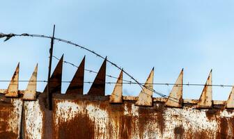 barbed wire fence against the sky war in Ukraine with Russia photo