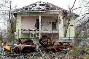 damaged and looted cars in a city in Ukraine during the war photo