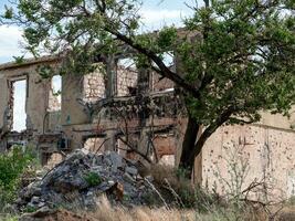 destroyed houses in an abandoned city without people in Ukraine photo