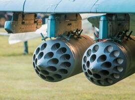 army military rocket launcher on the wing of an airplane photo