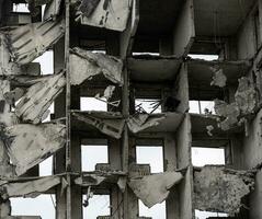 destroyed and burned houses in the city Russia Ukraine war photo