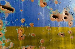 explosion damaged blue yellow wall war in Ukraine photo