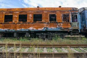 burned out blown up wagons in Ukraine photo