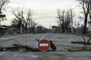 damaged and looted cars in a city in Ukraine during the war photo