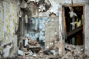 destroyed and burned houses in the city during the war in Ukraine photo