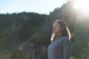 Woman relaxes in the Garraf Natural Park and receives the sun's rays. photo