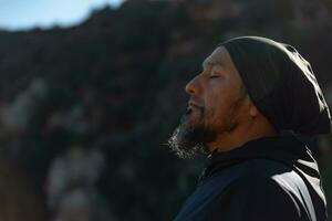 Man relaxes in the Garraf Natural Park and receives the sun's rays. photo