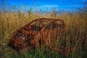 Abandoned Car on a Beach photo