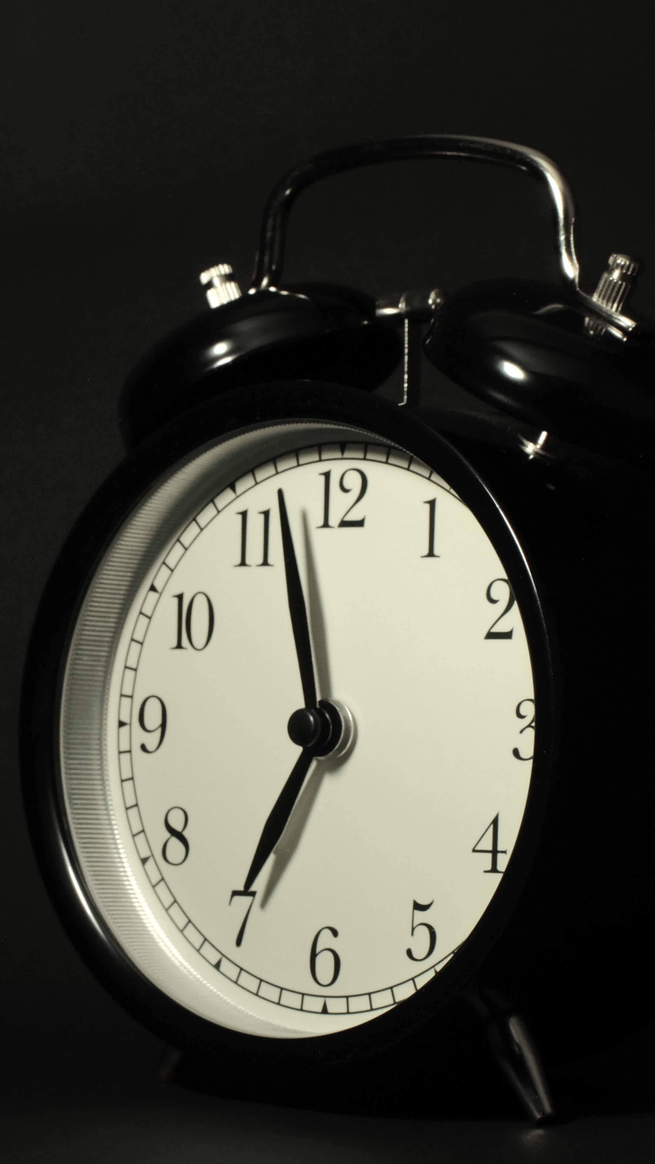 Vertical time lapse video of a clock time passing over a day to night