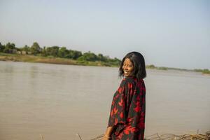 outdoor fashion photo of beautiful happy lady at the beach