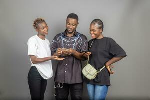 cute african man counting money while his friend are looking at him photo