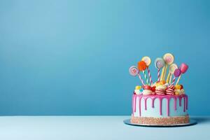 AI generated Birthday cake with lollipops and candies on blue background, Birthday cake adorned with candies on a blue background with copy space, AI Generated photo