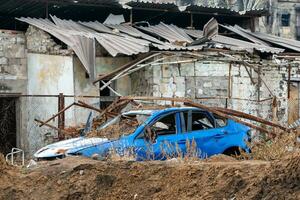 damaged and looted cars in a city in Ukraine during the war photo