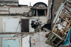 destroyed and burned houses in the city during the war in Ukraine photo