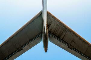 wings of a large airliner on a blue background photo