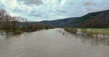 Drone video of the German river Main during a flood with flooded trees on the banks