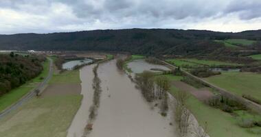 Drone video of the German river Main during a flood with flooded trees on the banks