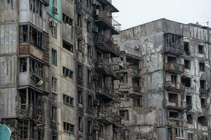 destroyed and burned houses in the city Russia Ukraine war photo