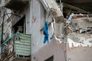 destroyed and burned houses in the city during the war in Ukraine photo