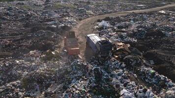 garbage truck unloaded in a landfill, drone view video