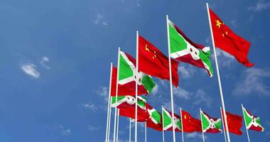 Burundi and China Flags Waving Together in the Sky, Seamless Loop in Wind, Space on Left Side for Design or Information, 3D Rendering video