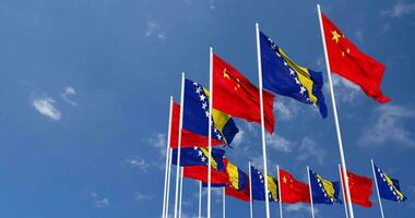 Bosnia and Herzegovina and China Flags Waving Together in the Sky, Seamless Loop in Wind, Space on Left Side for Design or Information, 3D Rendering video
