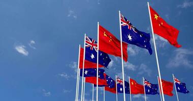 Australia and China Flags Waving Together in the Sky, Seamless Loop in Wind, Space on Left Side for Design or Information, 3D Rendering video