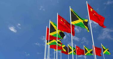 Jamaica and China Flags Waving Together in the Sky, Seamless Loop in Wind, Space on Left Side for Design or Information, 3D Rendering video