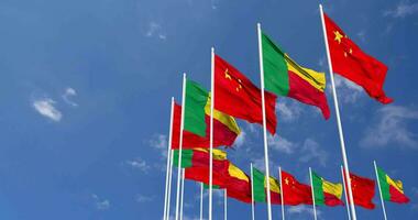 Benin and China Flags Waving Together in the Sky, Seamless Loop in Wind, Space on Left Side for Design or Information, 3D Rendering video