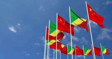 Congo and China Flags Waving Together in the Sky, Seamless Loop in Wind, Space on Left Side for Design or Information, 3D Rendering video