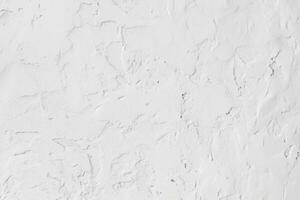 Textured of concrete plaster wall and white background photo