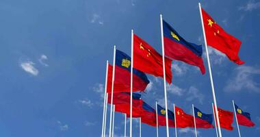 Liechtenstein and China Flags Waving Together in the Sky, Seamless Loop in Wind, Space on Left Side for Design or Information, 3D Rendering video