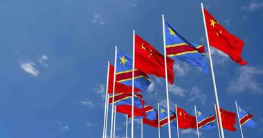 DR Congo and China Flags Waving Together in the Sky, Seamless Loop in Wind, Space on Left Side for Design or Information, 3D Rendering video