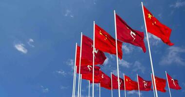 Isle of Man and China Flags Waving Together in the Sky, Seamless Loop in Wind, Space on Left Side for Design or Information, 3D Rendering video