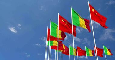 Mali and China Flags Waving Together in the Sky, Seamless Loop in Wind, Space on Left Side for Design or Information, 3D Rendering video