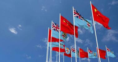 Fiji and China Flags Waving Together in the Sky, Seamless Loop in Wind, Space on Left Side for Design or Information, 3D Rendering video