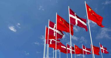 Denmark and China Flags Waving Together in the Sky, Seamless Loop in Wind, Space on Left Side for Design or Information, 3D Rendering video