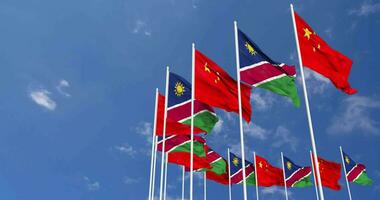 Namibia and China Flags Waving Together in the Sky, Seamless Loop in Wind, Space on Left Side for Design or Information, 3D Rendering video