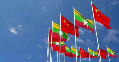 Myanmar, Burma and China Flags Waving Together in the Sky, Seamless Loop in Wind, Space on Left Side for Design or Information, 3D Rendering video