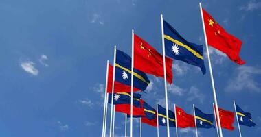 Nauru and China Flags Waving Together in the Sky, Seamless Loop in Wind, Space on Left Side for Design or Information, 3D Rendering video